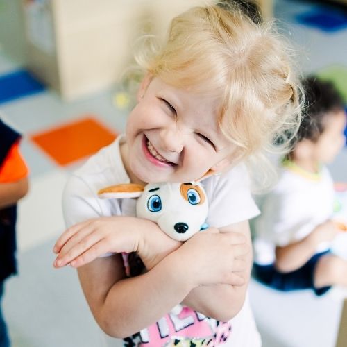 Brighton Preschool Child Playing and Smiling in Preschool Classrooms