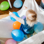 Child Playing with Balloons